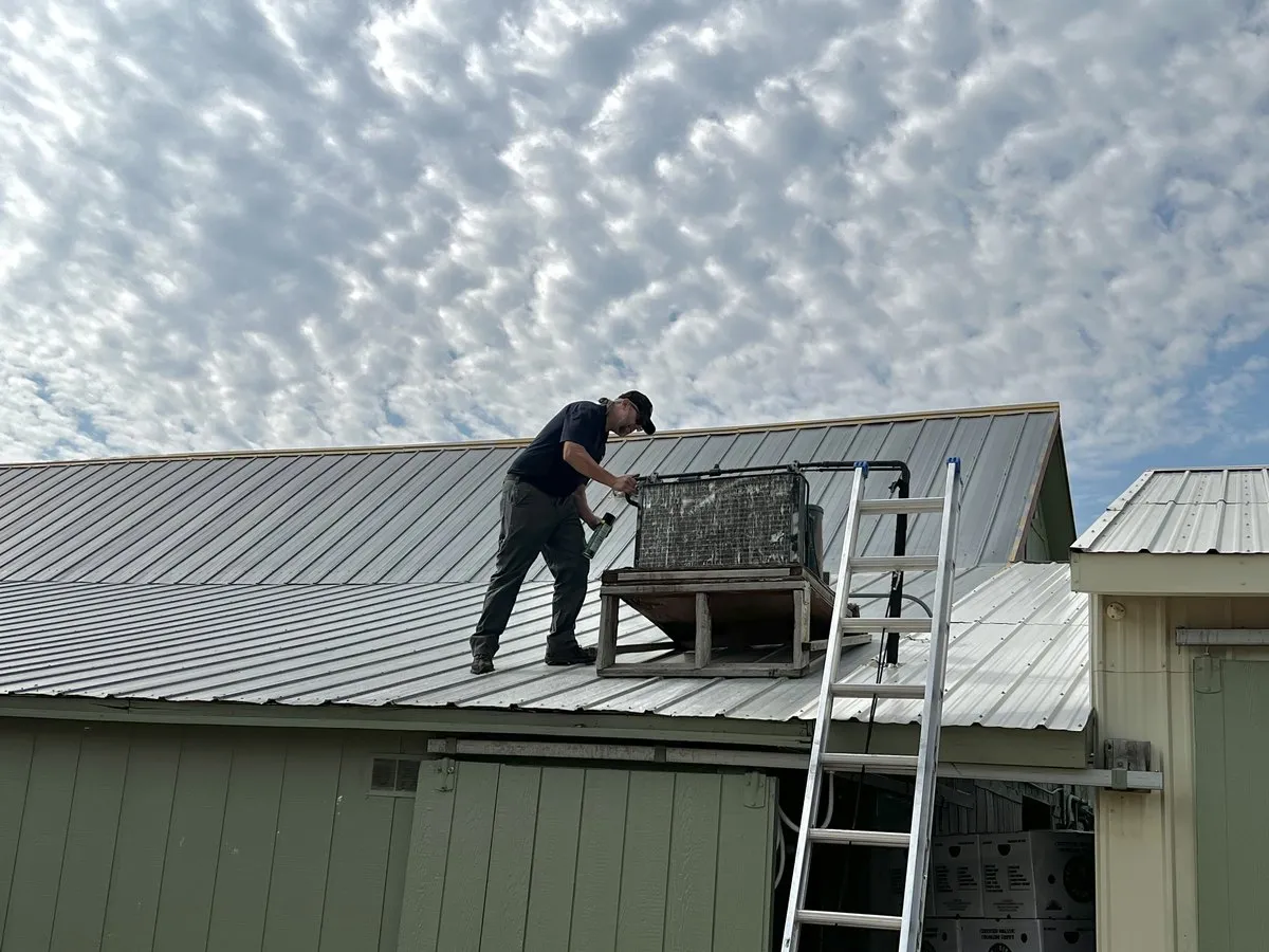 Georgia Boys technician servicing a rooftop HVAC unit